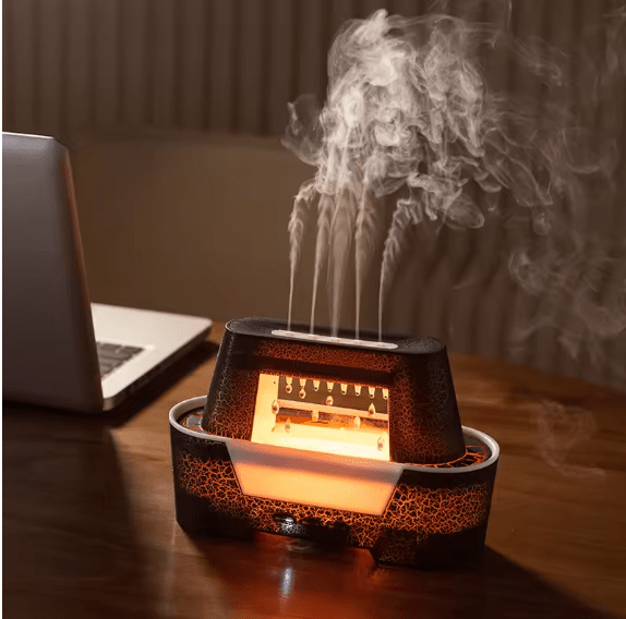 Raindrop aroma humidifier with warm flame light on a desk