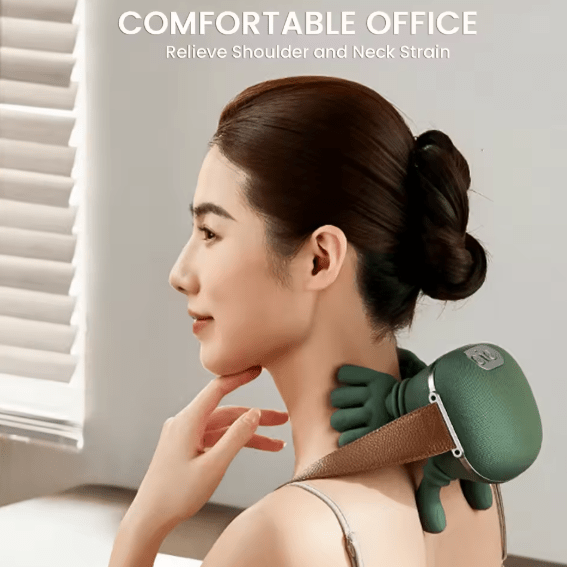 Woman using a green neck and shoulder kneading massager at her office desk